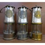 Three miner's lamps