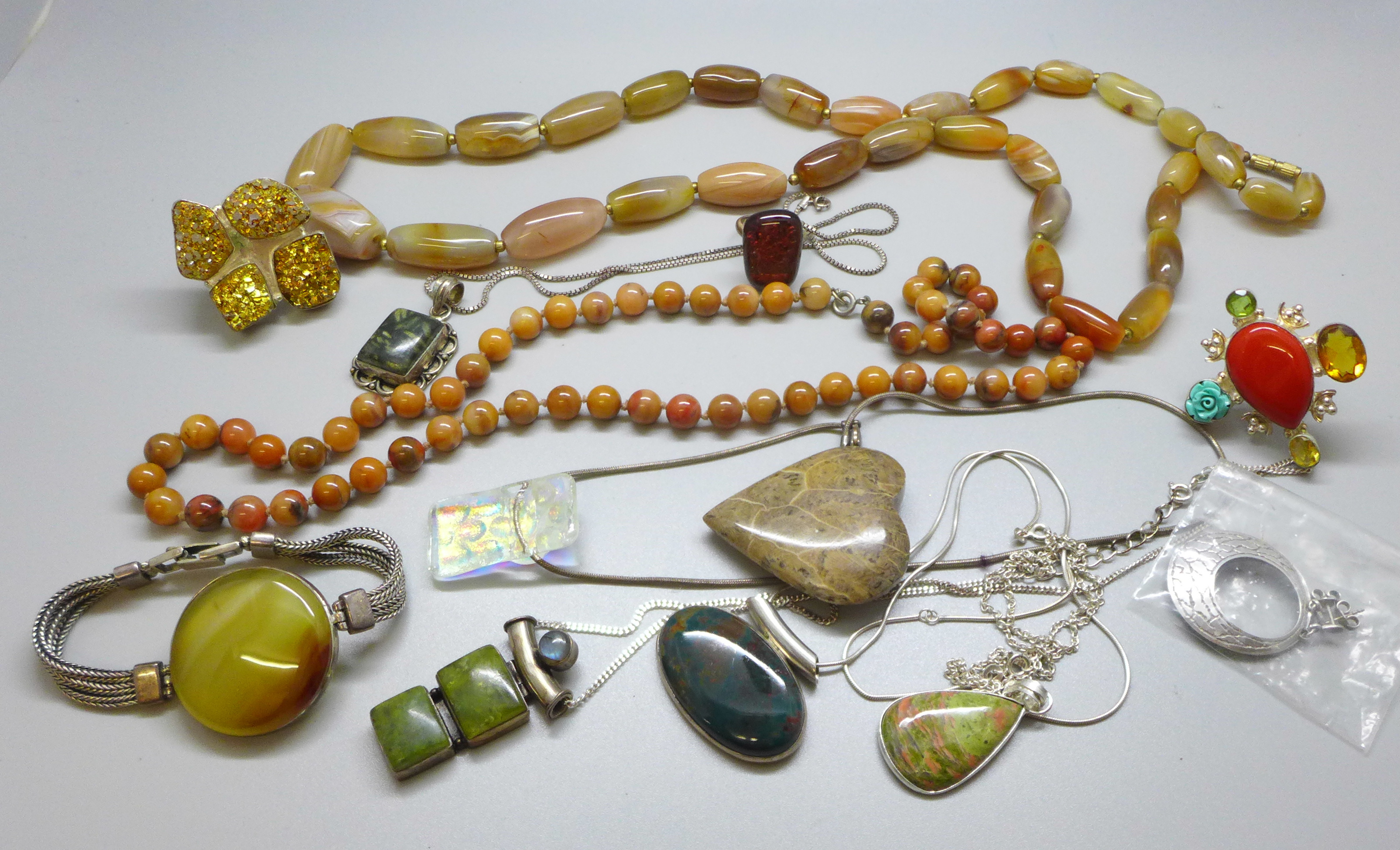 A collection of stone set jewellery, some silver set, including an agate bead necklace