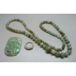 A jade necklace, carved jade and a ring