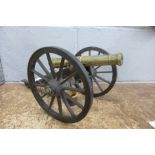 A brass and wood model cannon