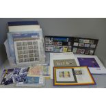 A collection of 15 year books and presentation packs of stamps