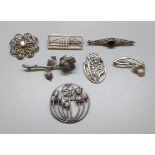 A collection of seven silver Art Nouveau style brooches