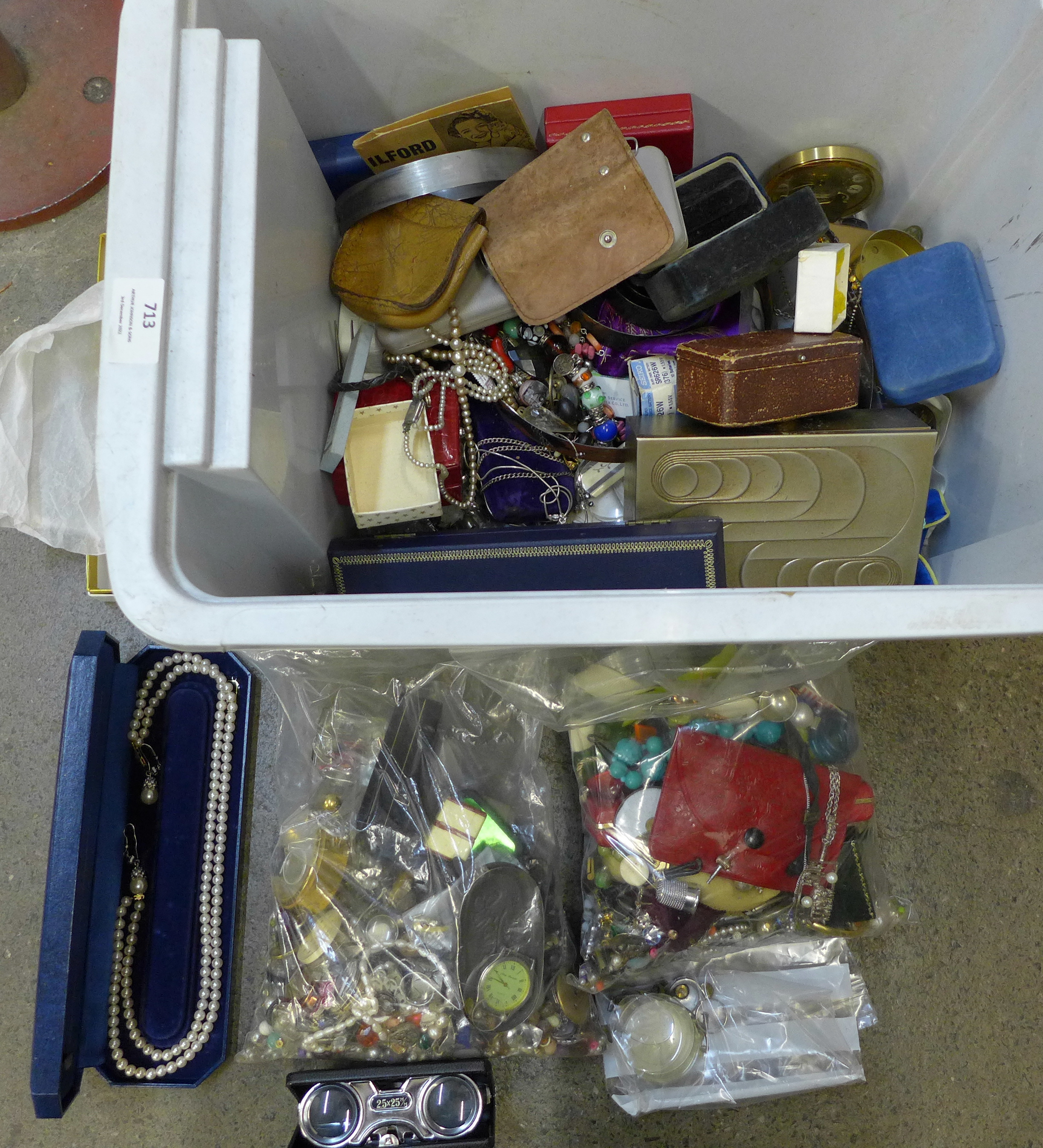 A large box of costume jewellery and watch components