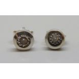 A pair of 9ct white gold and diamond stud earrings