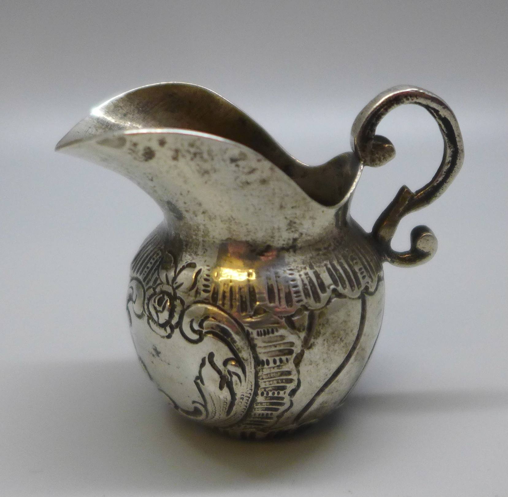 A continental silver small cream jug with control marks, 32g