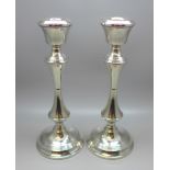 A silver pair of candlesticks, Birmingham 1969, weighted bases, 534g gross