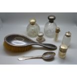 Two silver topped globular scent bottles, silver spoon, silver brush, etc.