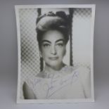 Joan Crawford: a black and white publicity photo, signed in blue biro, with original postage