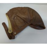 An early 20th century leather driver's hat