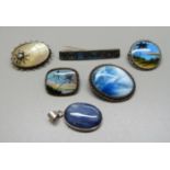 Five silver brooches and a silver pendant