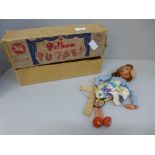A boxed Pelham puppet of a girl