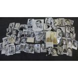 A collection of black and white publicity photos, some with printed signatures