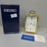 A Seiko mantel clock with receipt