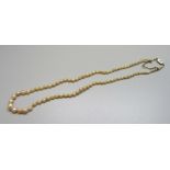 A pearl necklace with 15ct gold clasp