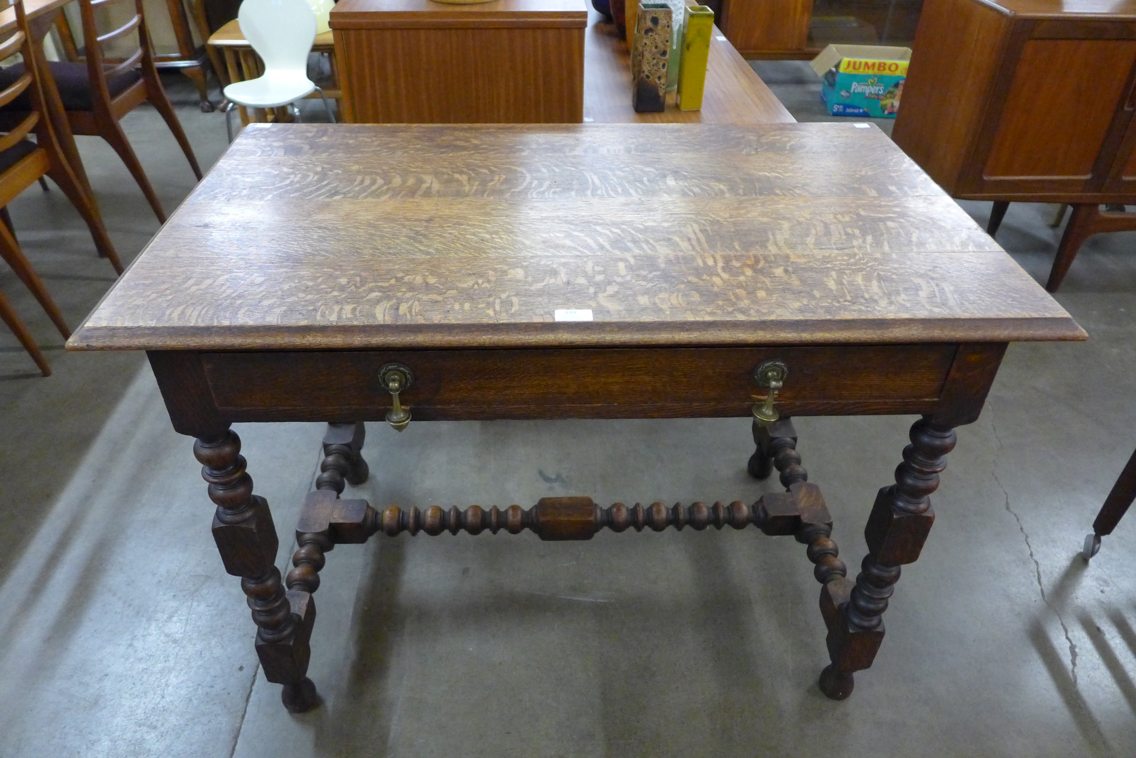 A late 19th Century French oak single drawer writing table