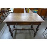 A late 19th Century French oak single drawer writing table