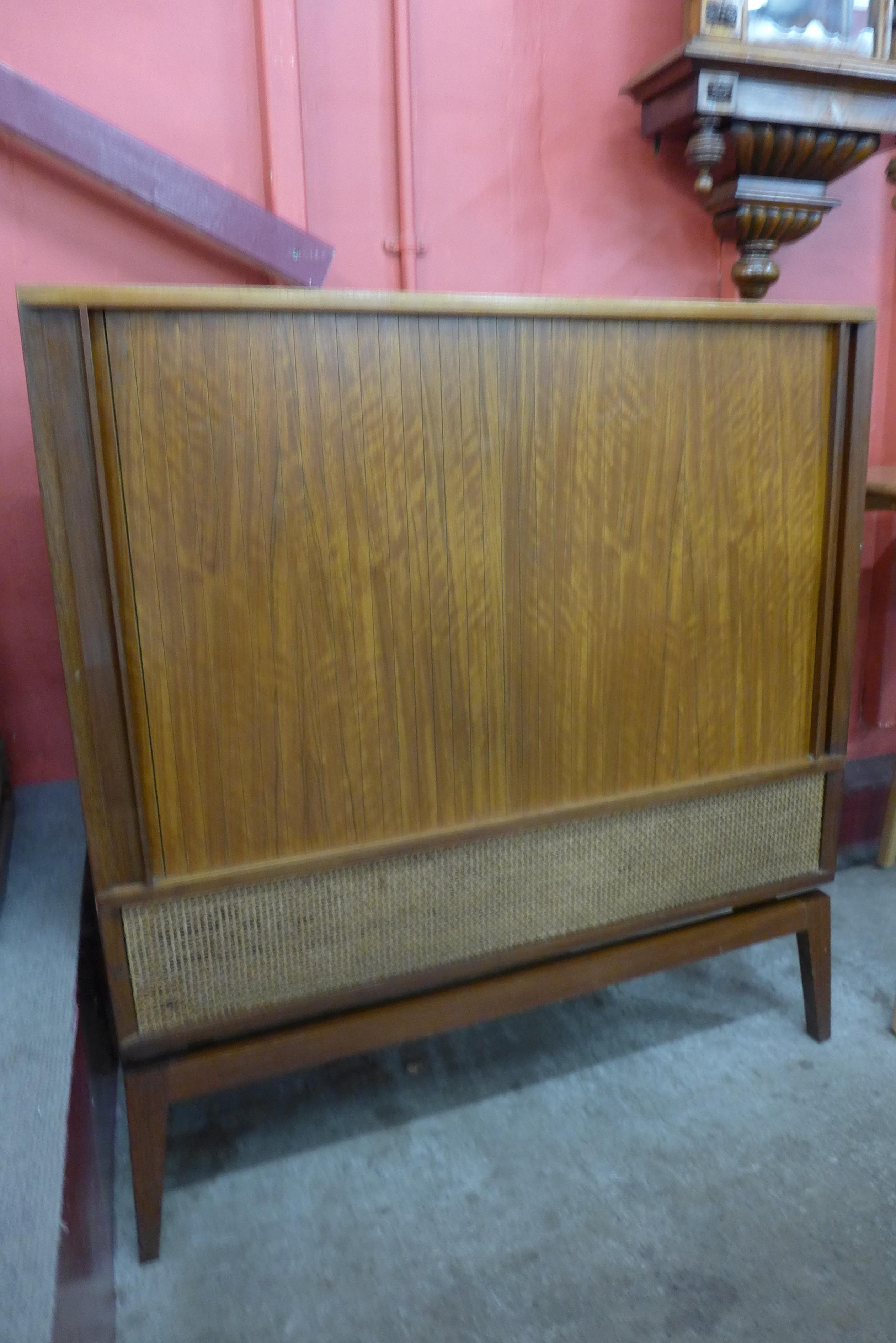 A Danish teak tambour front cabinet