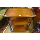 An Ercol Golden Dawn elm and beech Windsor trolley