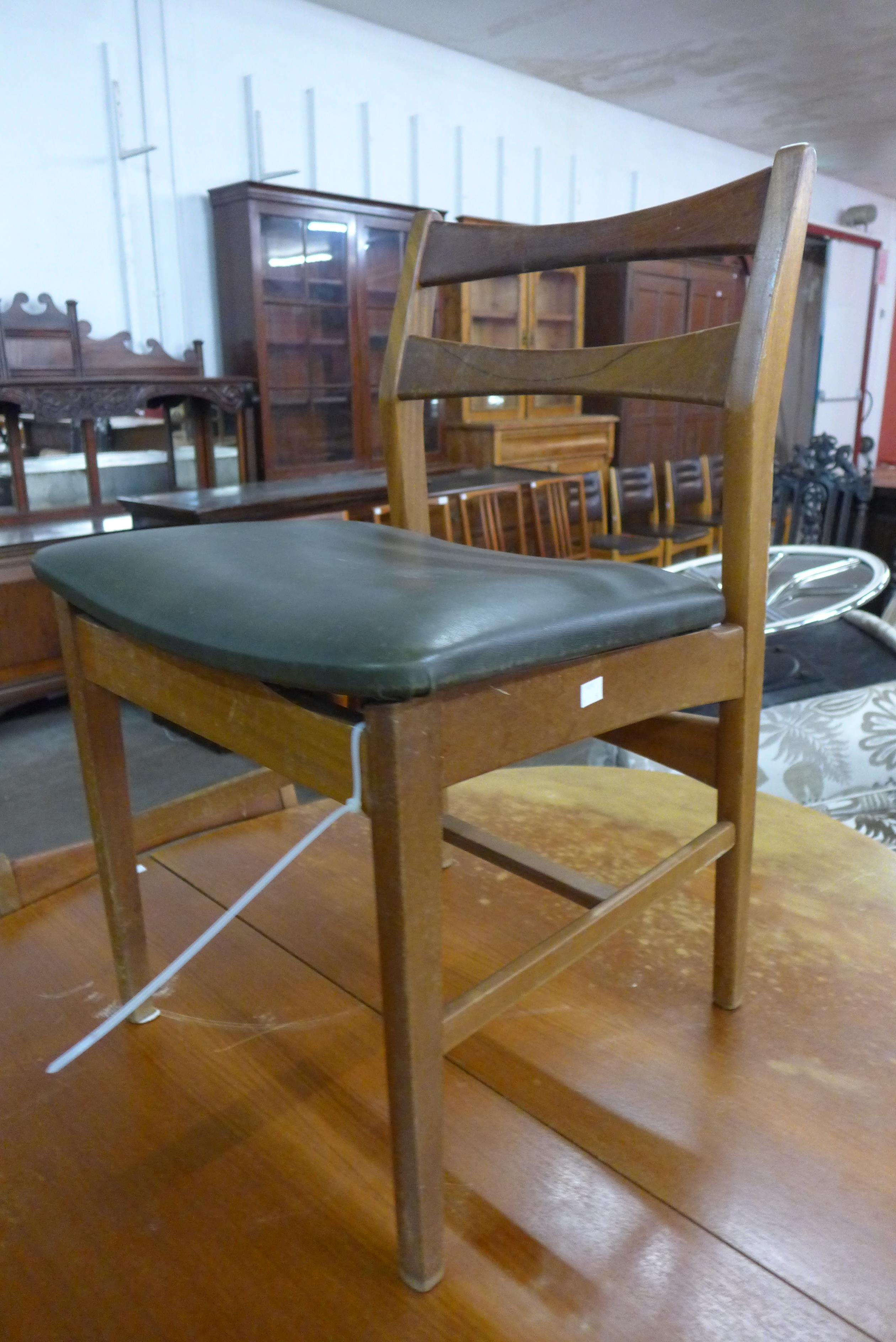 A teak extending dining table and four chairs - Image 2 of 2