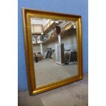 A gilt framed mirror