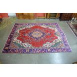 A Persian red ground Tabriz rug, 368 x 279cms