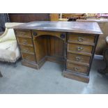 A Victorian Aesthetic Movement oak kneehole desk