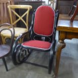 A black painted bentwood rocking chair