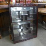 A Chinese hardwood wall hanging display cabinet