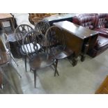 An oak gateleg table and four chairs