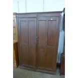 A Victorian pine two door housekeepers cupboard (interior shelves missing)