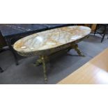 A French style brass and onyx topped oval coffee table