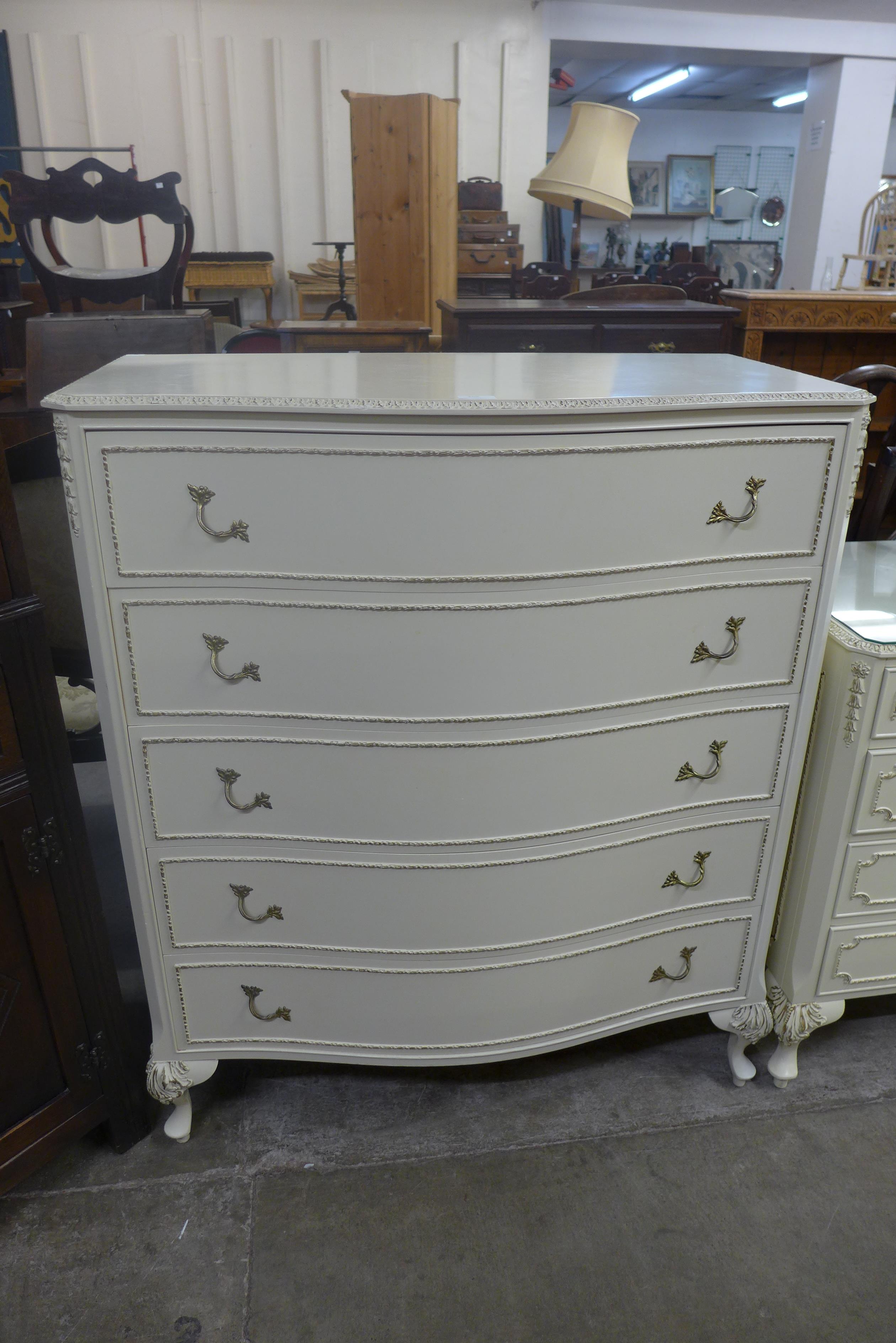 A French style cream and parcel gilt four piece bedroom suite