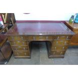 A Victorian Gothic Revival oak and red leather topped desk, manner of A.W.N. Pugin