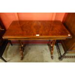 An early Victorian carved walnut fold over rectangular card table