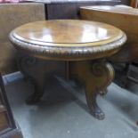 A Beidermeier circular walnut coffee table