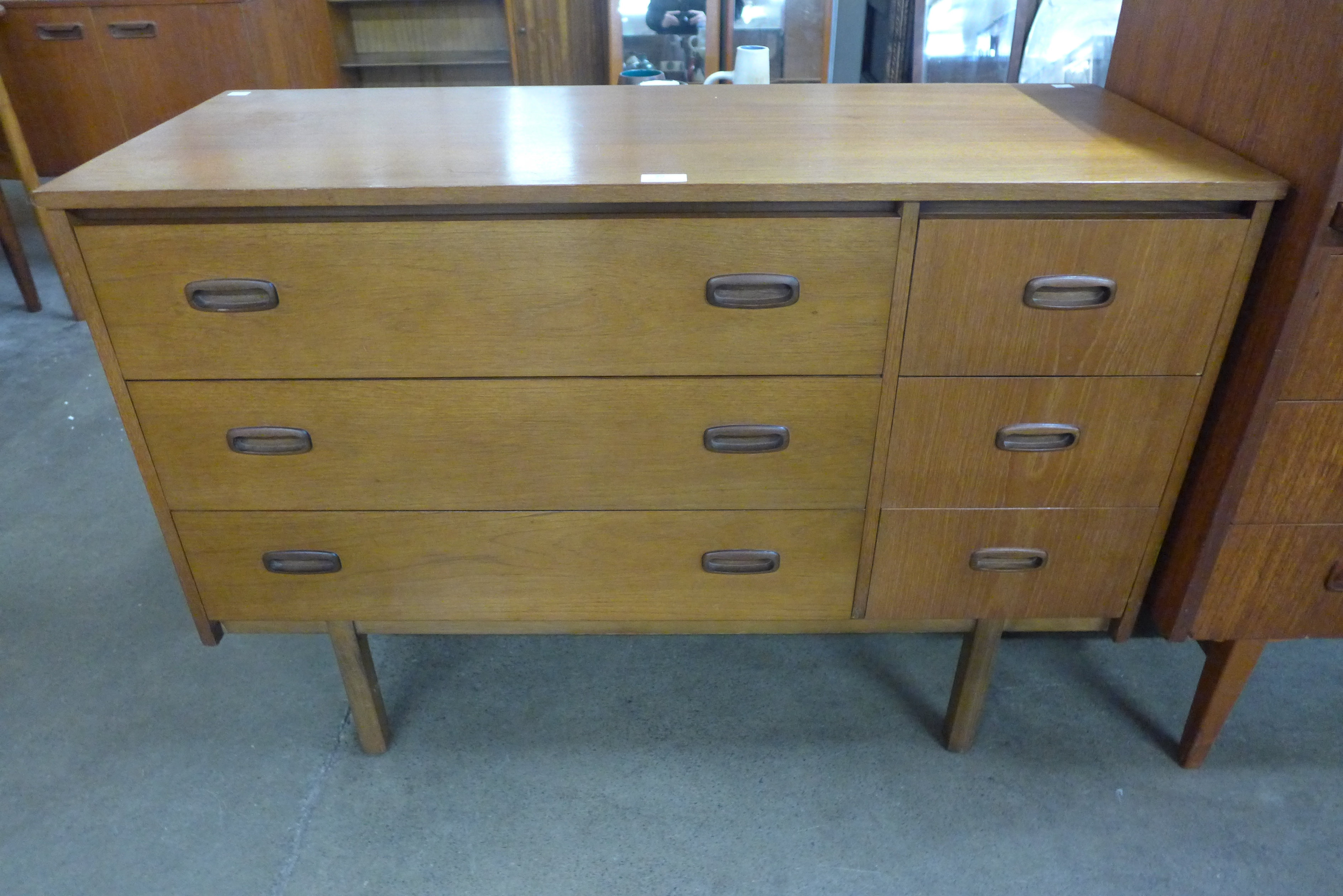 A teak six drawer sideboard