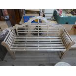 A Lutyens style teak garden bench and coffee table