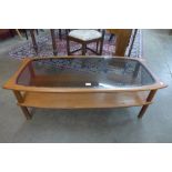 A G-Plan teak and smoked glass topped coffee table