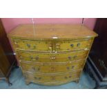 A Sheraton Revival painted satinwood bow front chest of drawers