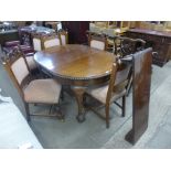 An Edward VII mahogany oval extending dining table and six Victorian carved walnut dining chairs