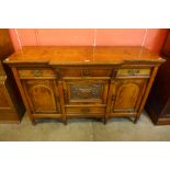 A Victorian oak and pollard oak breakfront sideboard