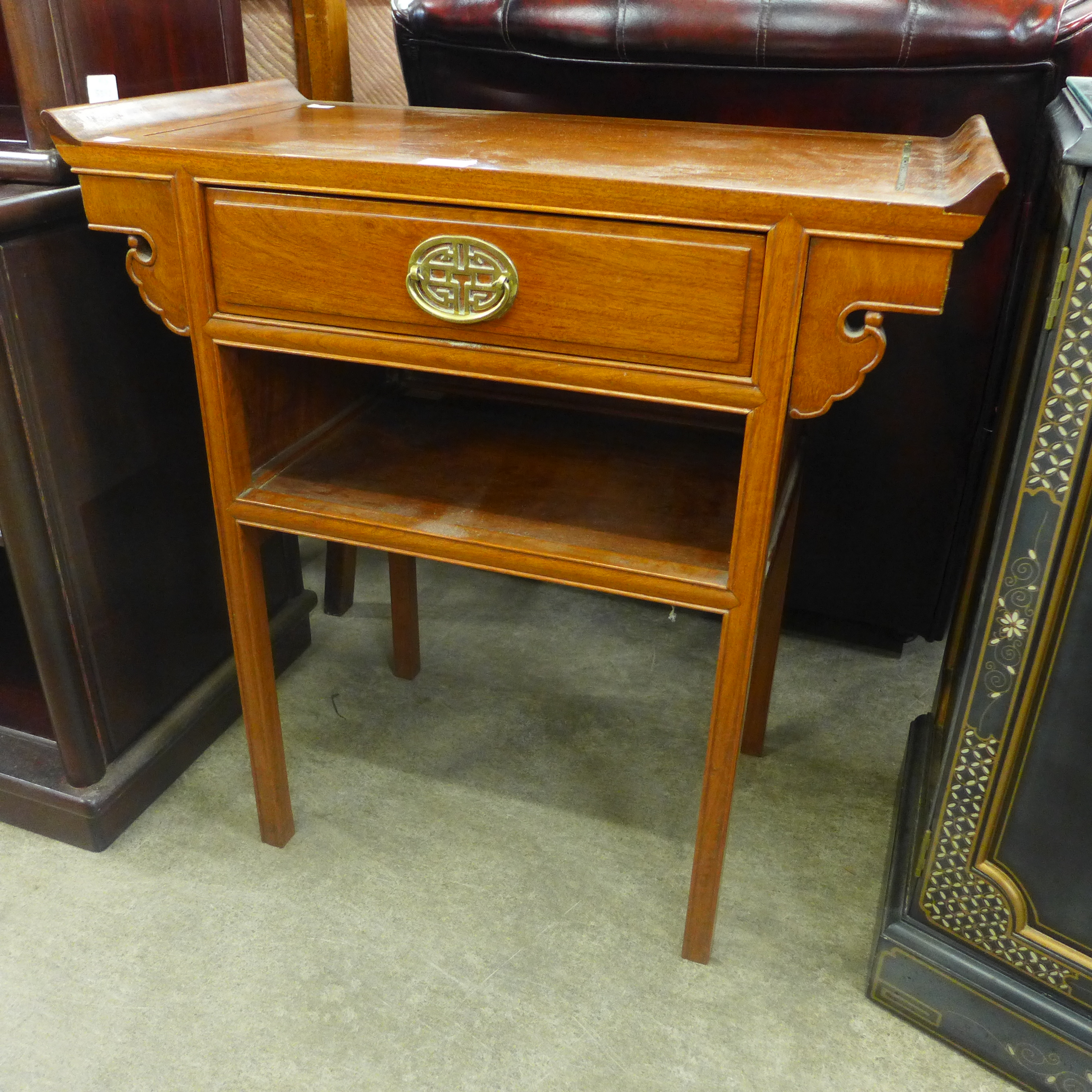 A small Chinese hardwood single drawer console table