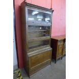 An early 20th Century Lebus oak five tier sectional stacking bookcase, 198cms h, 88cms w, 44cms d