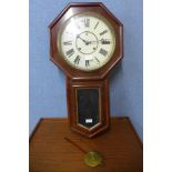 An American mahogany 8-day Waterbury wall clock