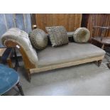 A Victorian beech and upholstered chaise longue