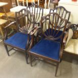 A set of four Hepplewhite style mahogany elbow chairs