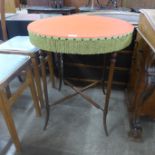 A late Victorian circular mahogany and felt top card table