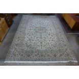 A Persian cream ground Kashan rug, 408 x 300cms