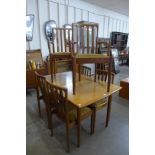 A Meredew teak extending dining table and six chairs