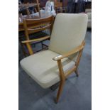 A Scandinavian beech and fabric upholstered armchair